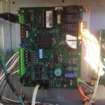A detailed circuit board featuring various electronic components and interconnected wires, showcasing intricate technology.